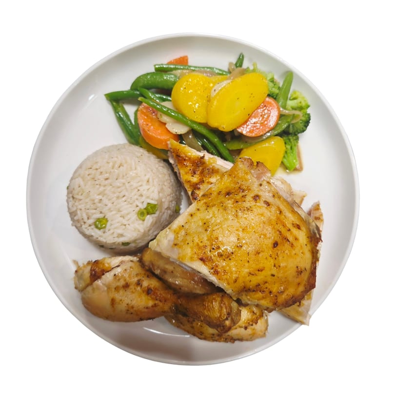 Grilled chicken pieces, rice with peas, and mixed vegetables including green beans, carrots, and yellow squash.