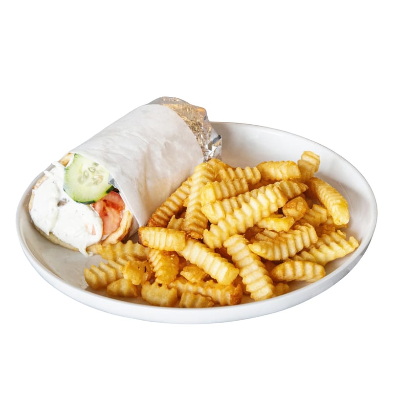 A Mediterranean gyro wrapped in paper with crinkle-cut fries on a white plate.